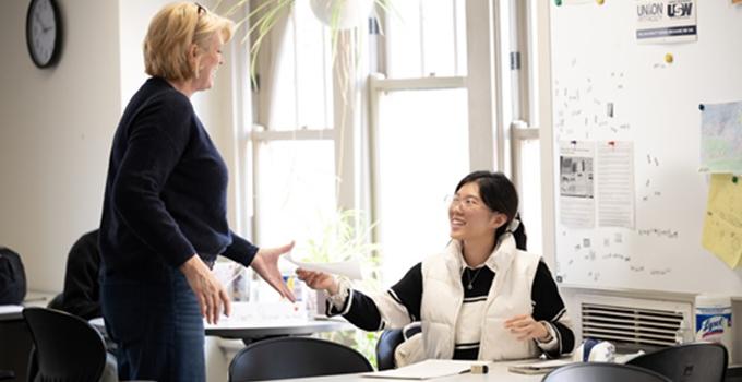 Professor talking with a student